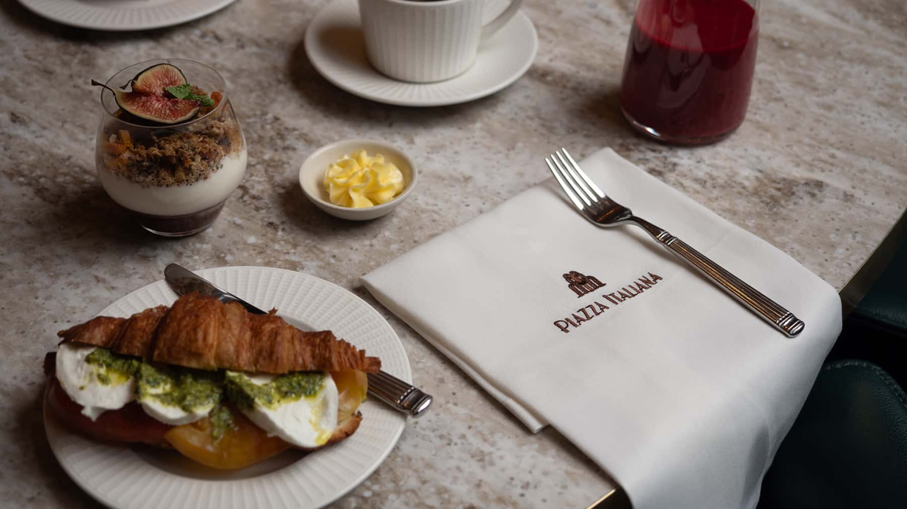 Interior of Piazza Italiana restaurant set for breakfast in the historic Banking Hall