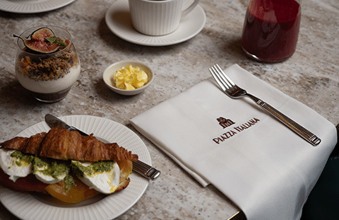 Freshly baked Italian cornetti and pastry selection at Piazza Italiana breakfast
